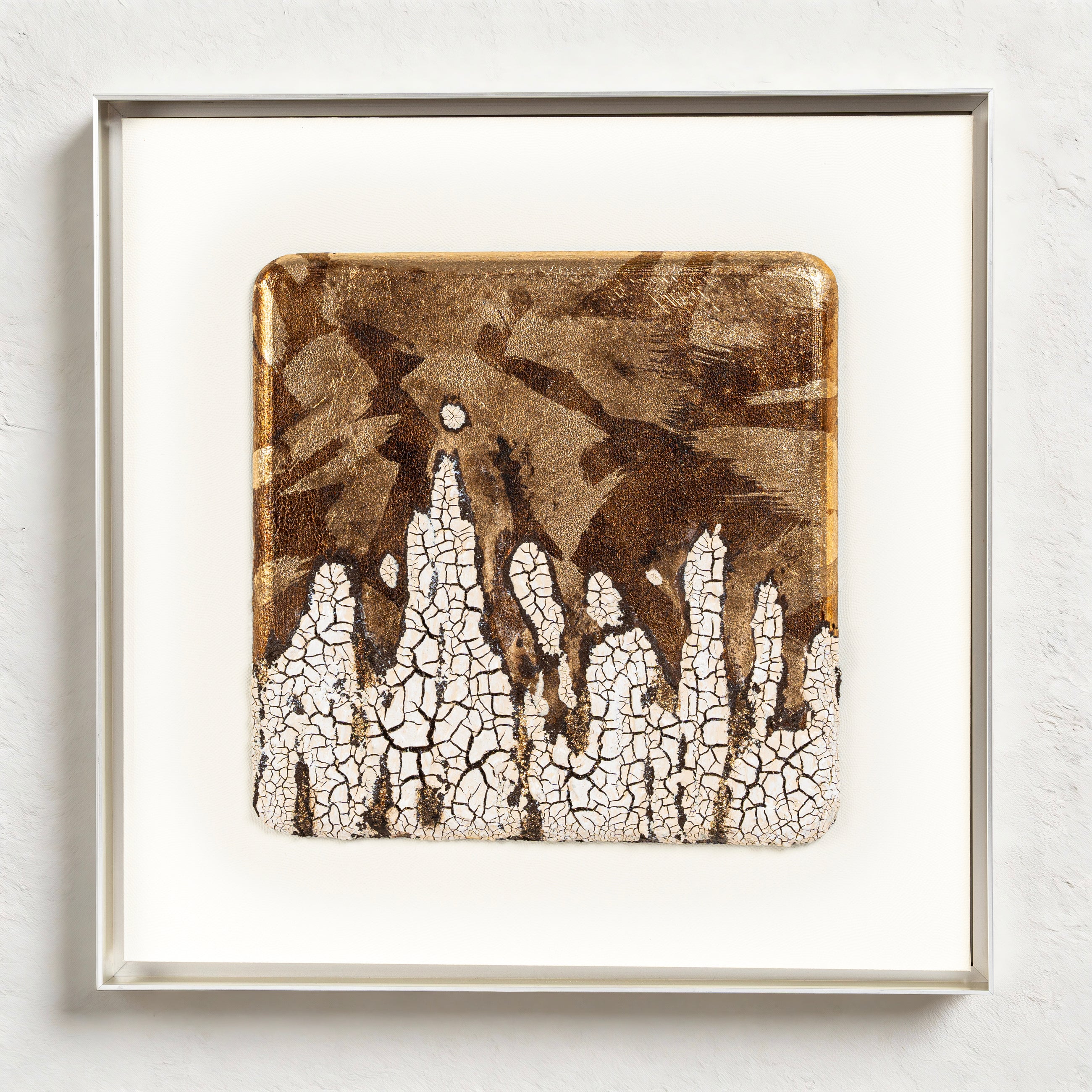 Efflorescence — Patinated Foil · Aura Frame, full view of a metal element wall art where deep brown crackle mineral terrain is set with integrated metallic plates and ICH-certified fired foil, the combined surface reading as ore found at the surface of excavated earth rather than placed upon it.