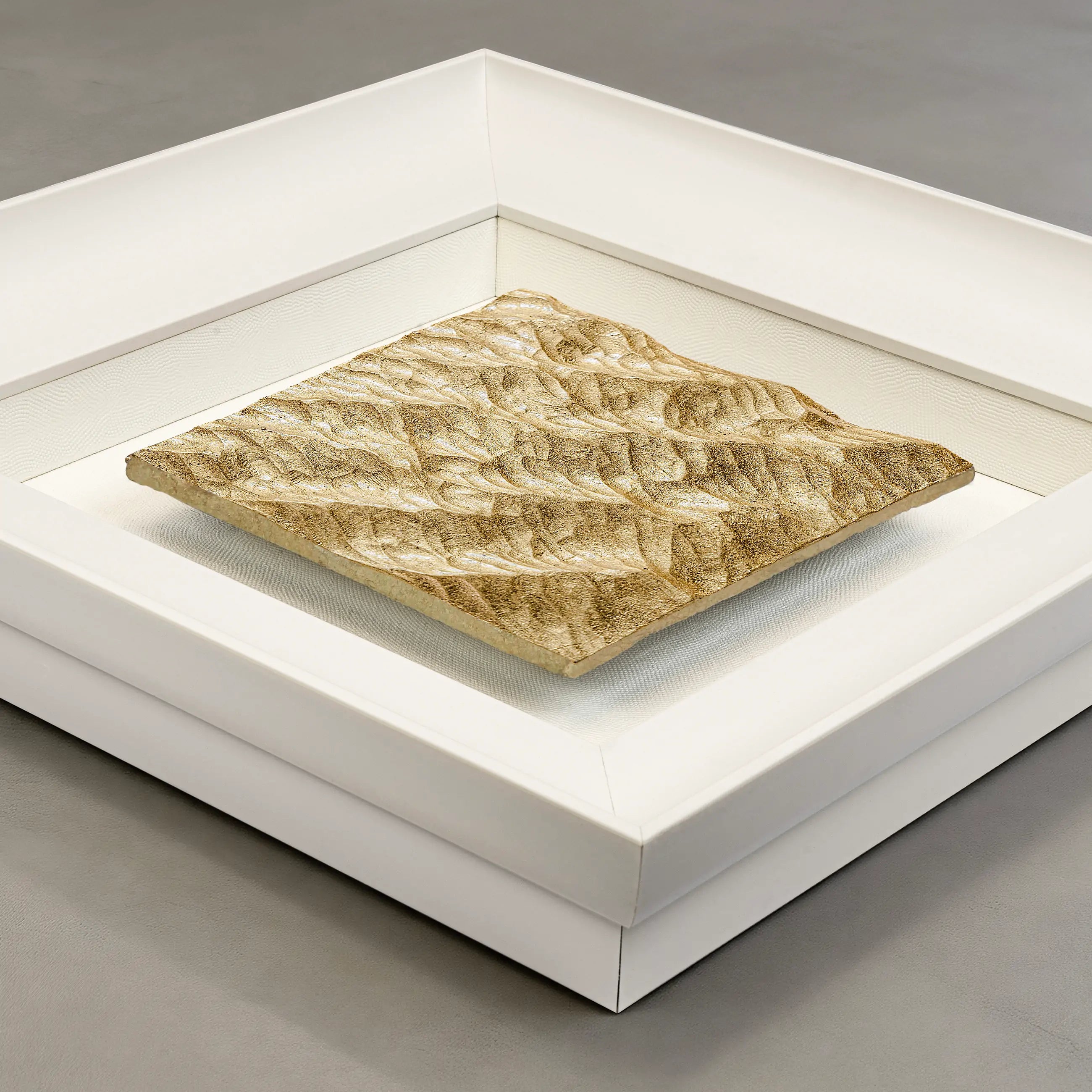 Flat-lay overhead view of Lunar Tide — Gilded Foil · Aura Frame, capturing the full expanse of its water element mineral surface — concentric ripple rings raised by hand across the entire terrain, gilded foil tracing every crest in the visual rhythm of a tide held still.
