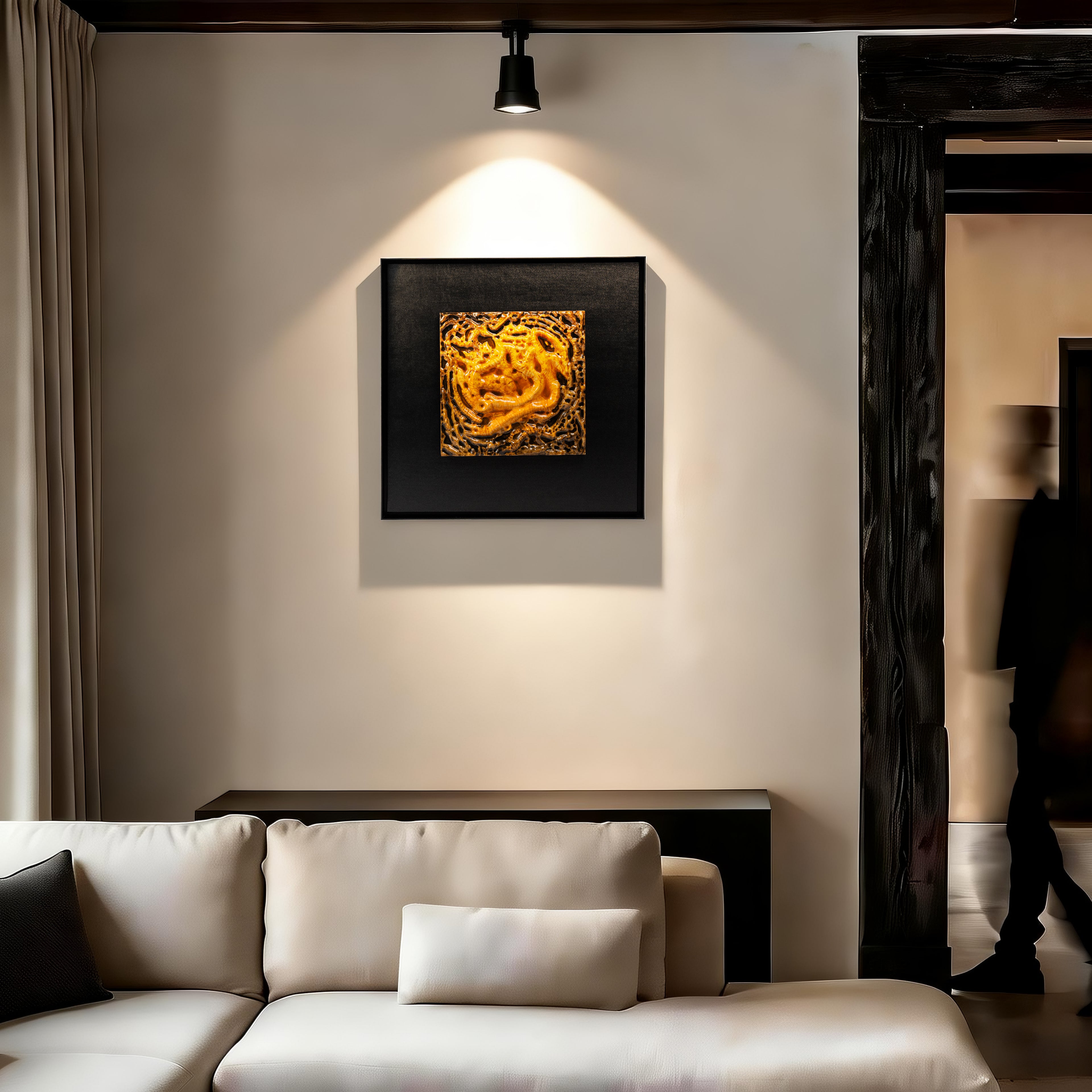 Coiled Dragon — Aquarelle · Aura Frame displayed in an interior setting, its earth element energy and layered mineral texture — warm pale ridges descending into deep umber contours — bringing the settled weight of ancient mountain terrain to the wall.
